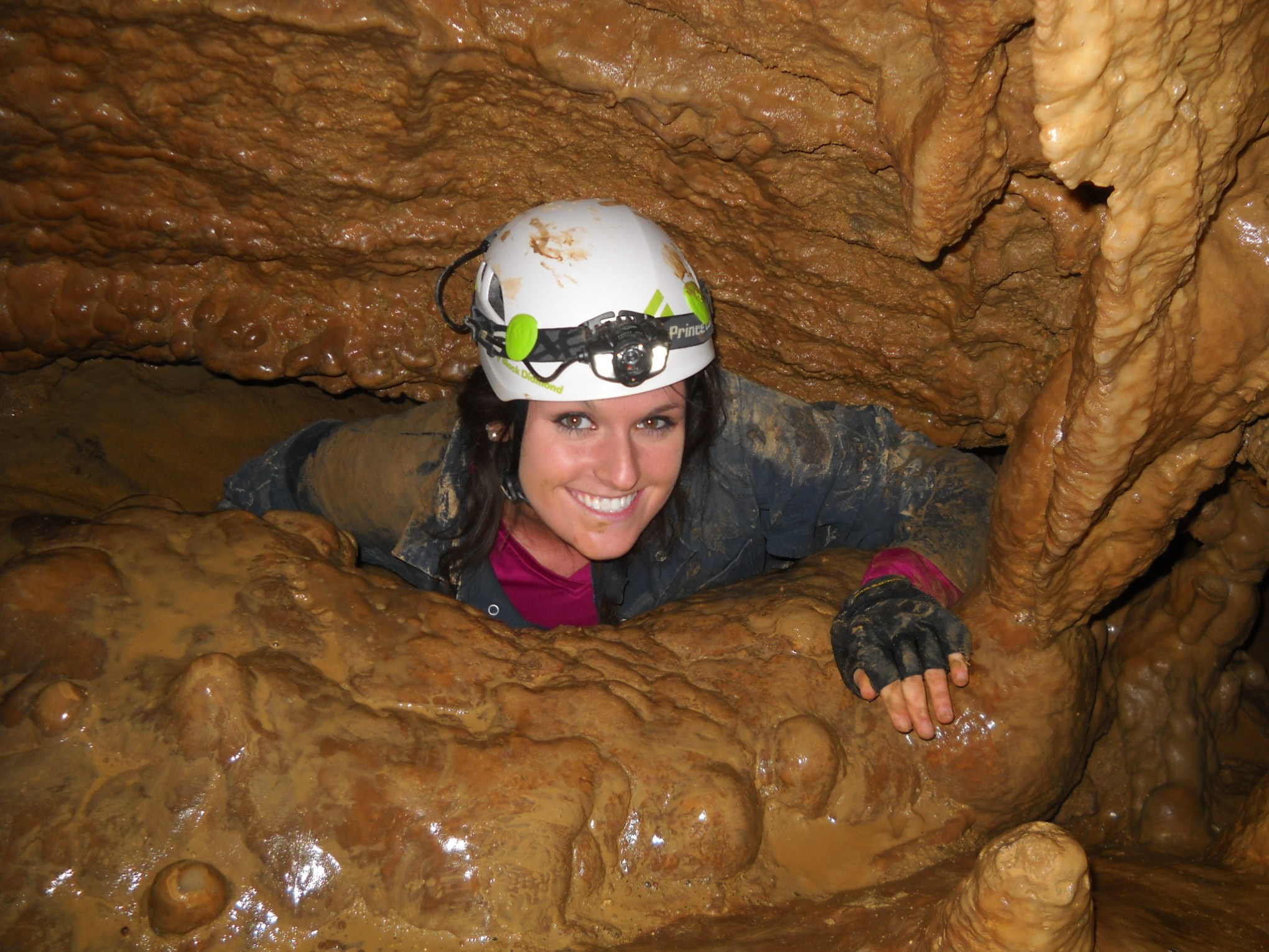 Girl crawling out of cavern