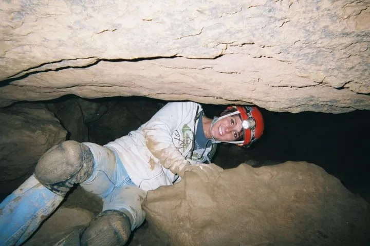 Girl moving through rock opening